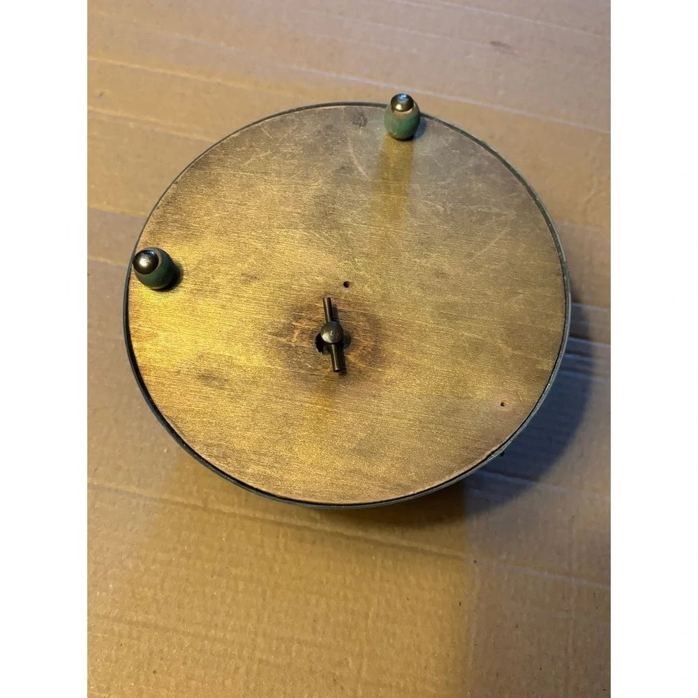 This vintage Victorian powder/music box is a rare and charming collectible piece